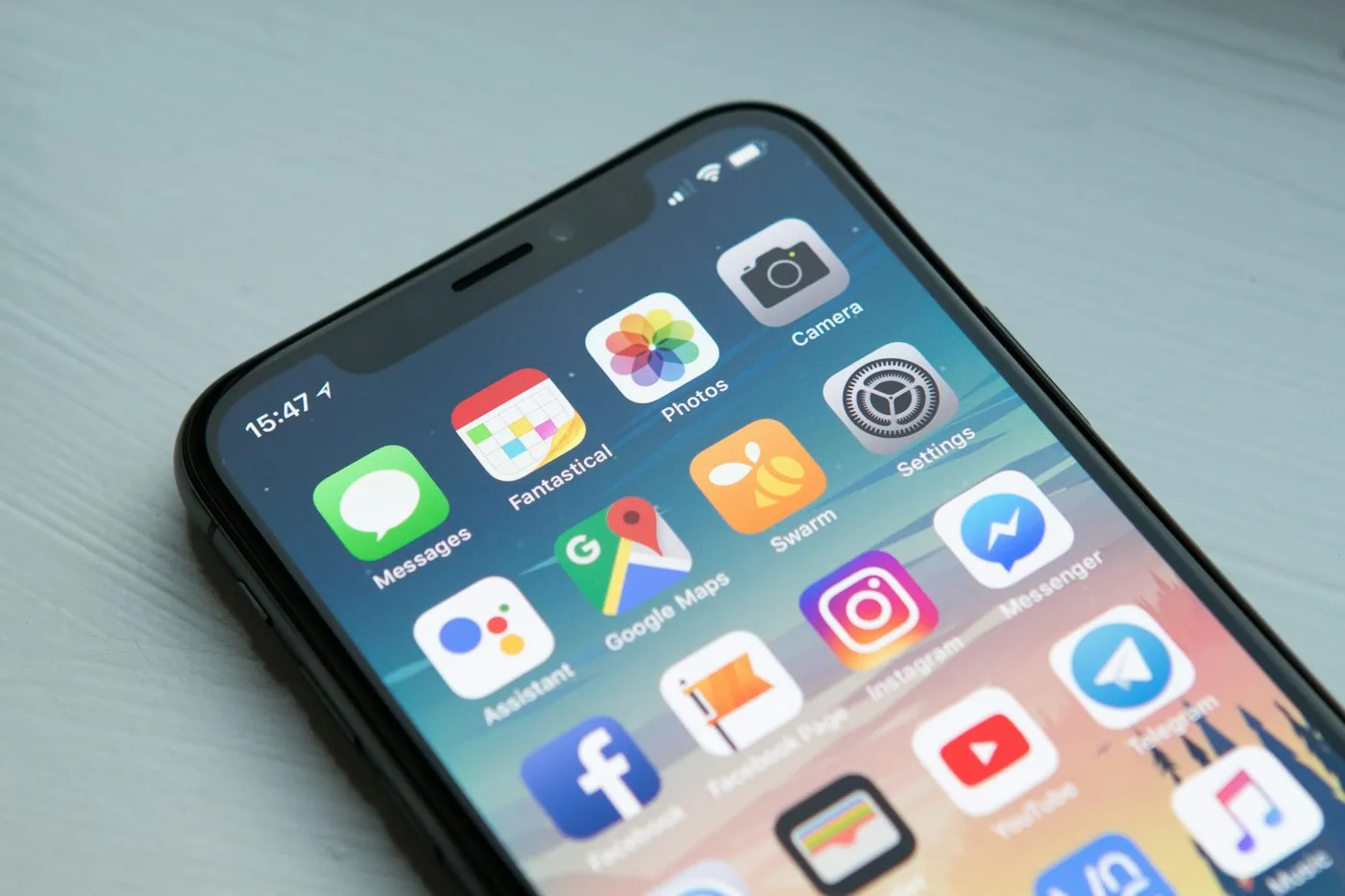 Smartphone home screen full of social media and messaging app icons