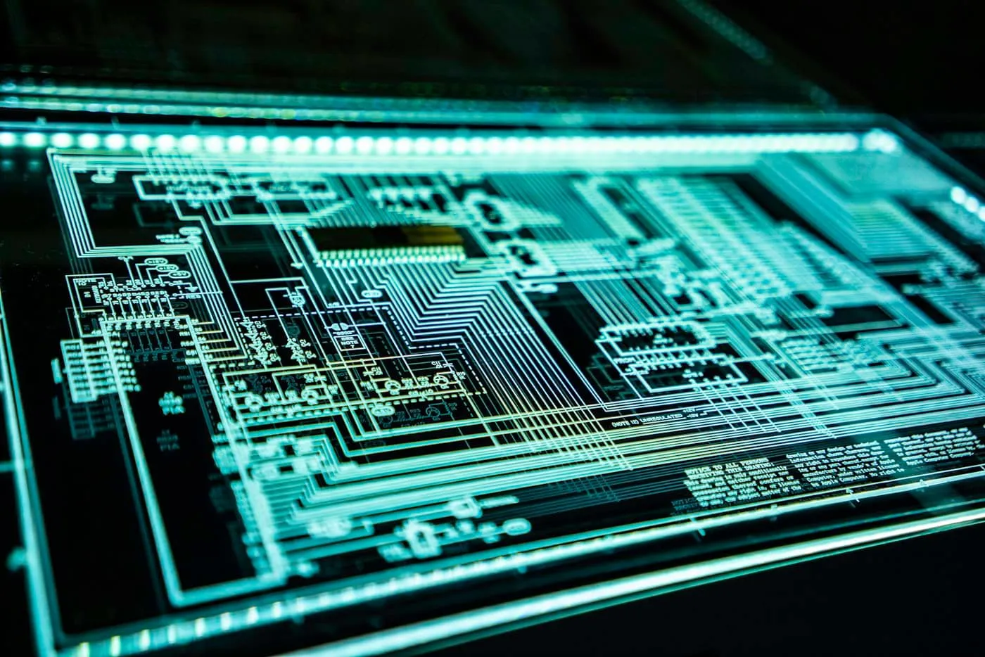Glowing teal circuit board pattern representing digital security
